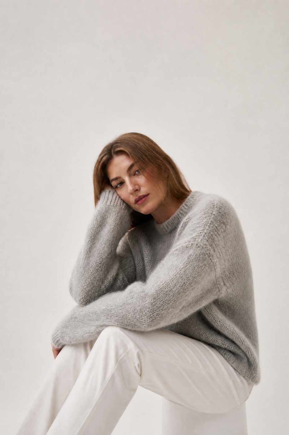 Brushed ivory mohair knit sweater on model with full headroom showing loft and texture from mohair fiber programs